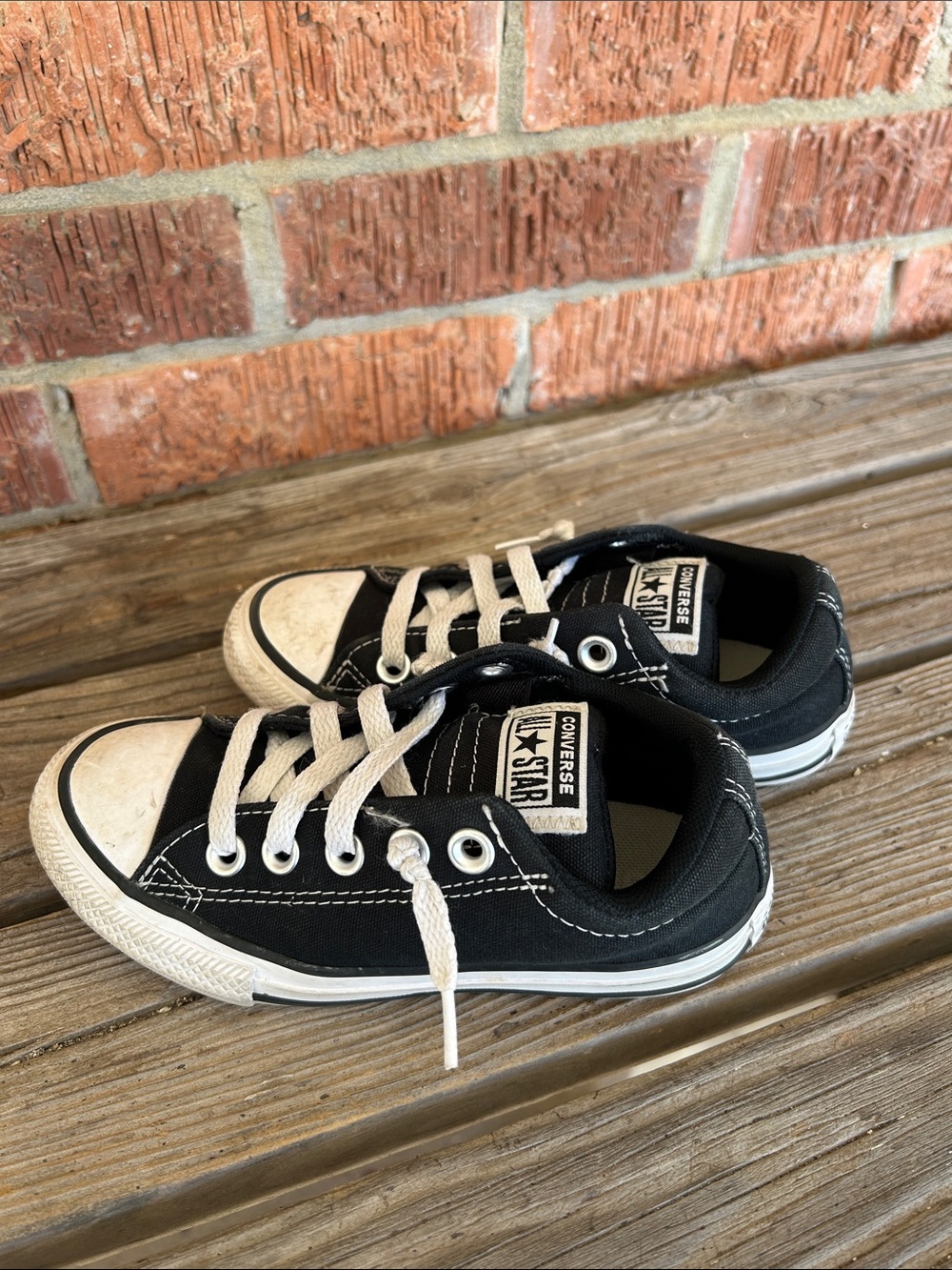 Converse Kids Black and White Low Top Sneakers.